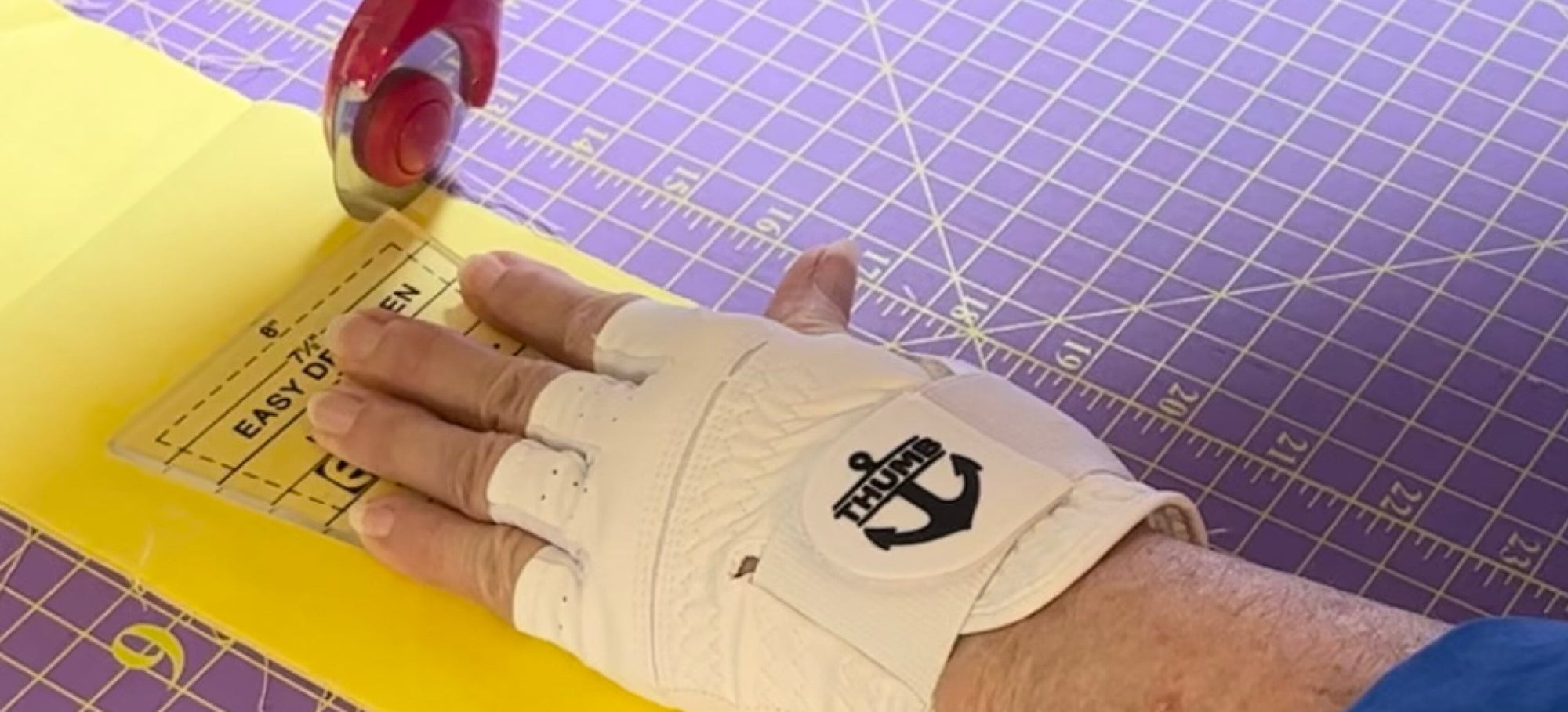 Pattern Cutting with White Fingerless Arthritis Glove for Quilters
